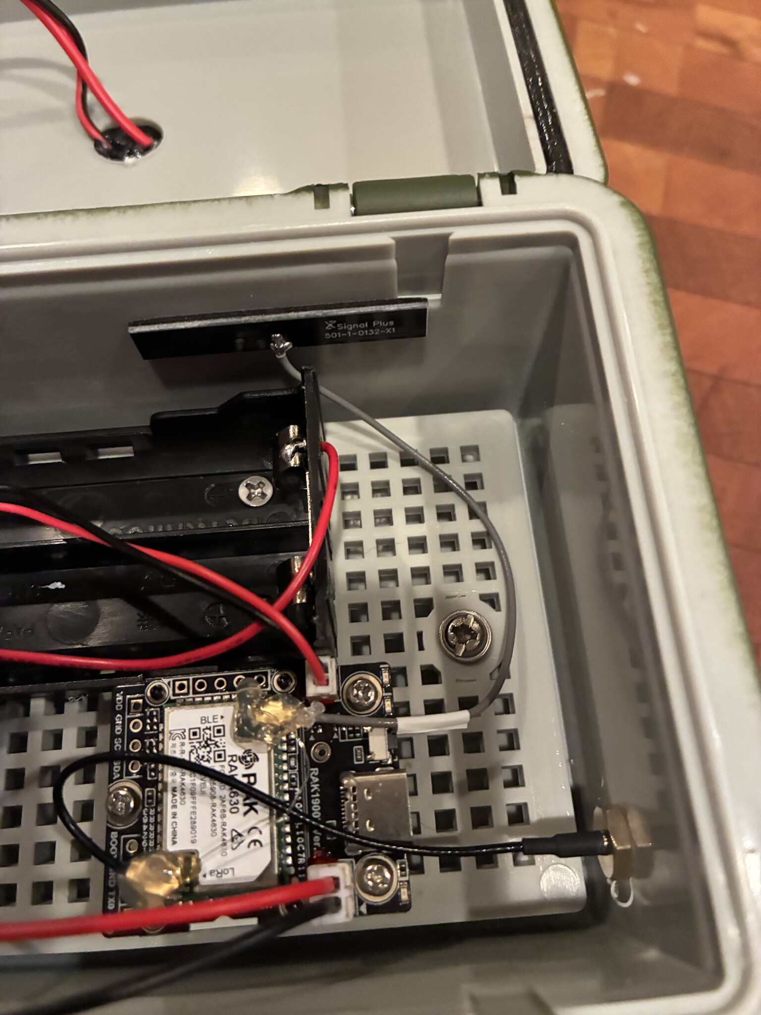 IPX antenna pigtail connected to the RAK4631 board inside the enclosure