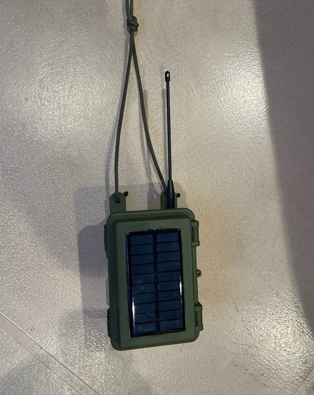 TALON R1 finished product — rugged OD green enclosure with solar panel and antenna